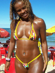 Afro girl on a beach. She's a sexy and..